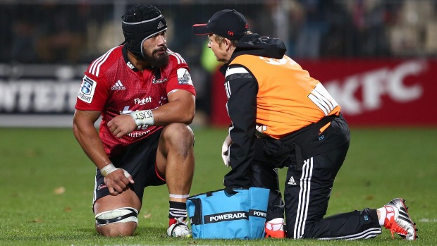 Jordan Taufua of the Crusaders is checked by team doctor Deb Robinson after a head knock last year.